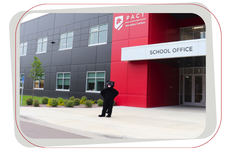 panther mascot standing in front of building